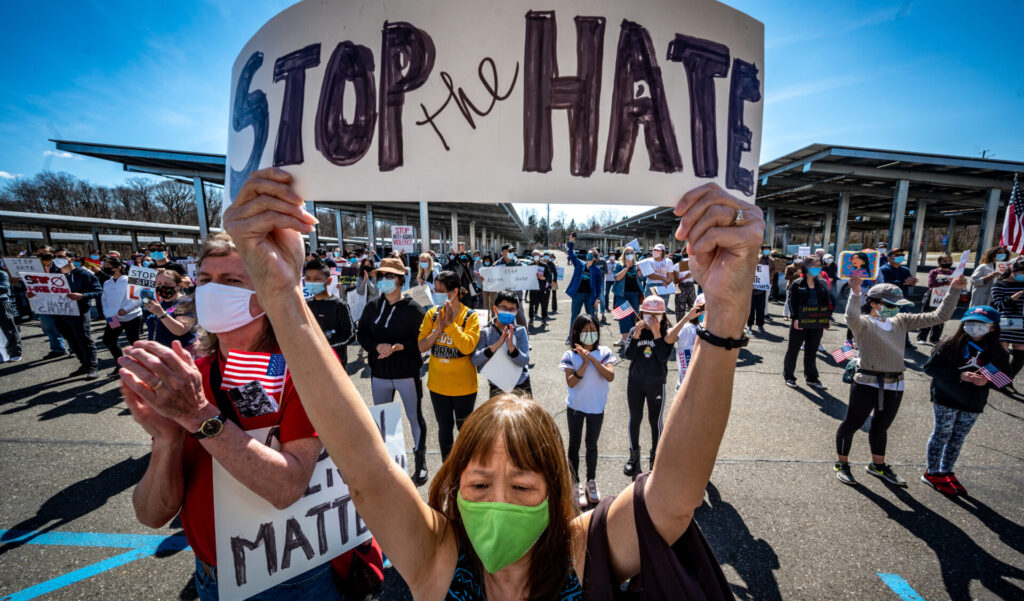 Protester with Stop the Hate sign
